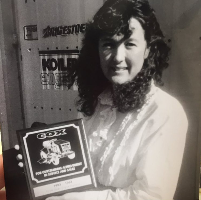 Maree Westcott with a Cox award for outstanding achievement in service and sales, 1993 to 1994