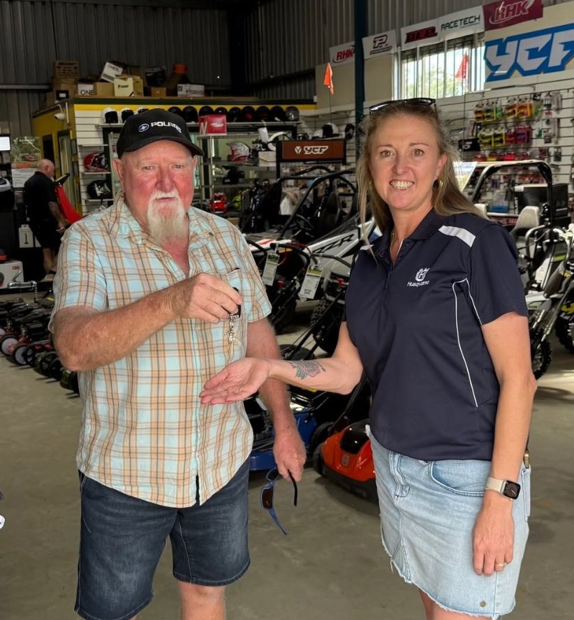 Paul Westcott handing the keys to Melissa Milford